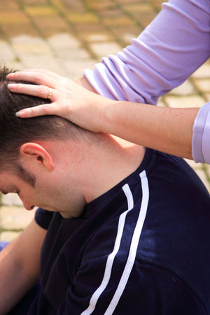 Stretching the neck  as part of a Thai body massageの写真素材