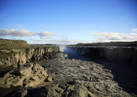 View across the powerful Dettifoss waterfallの写真素材