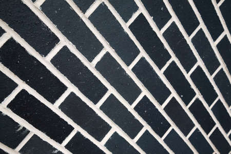 Black bricks and white mortar cement の写真素材