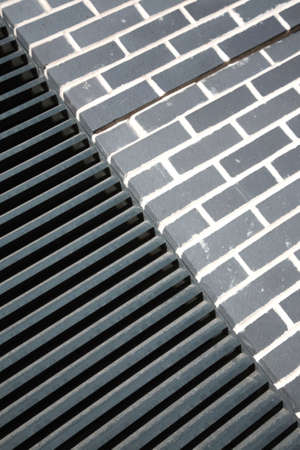 Two very different architectural textures metal and bricksの写真素材