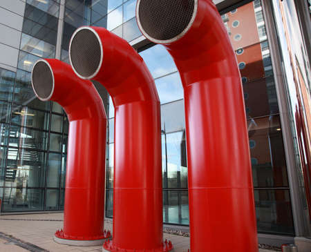 Three red air vents in Leeds UKの写真素材