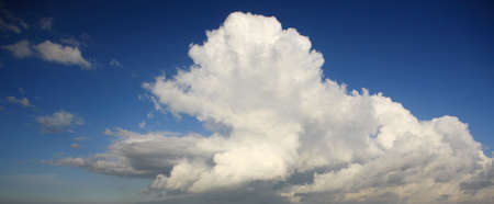 Amazing cloud formations against a bright blue skyの写真素材