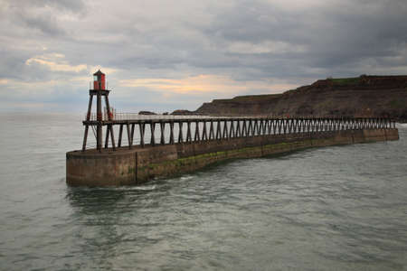 East Pier, Whitby, North Yorkshire at duskの写真素材