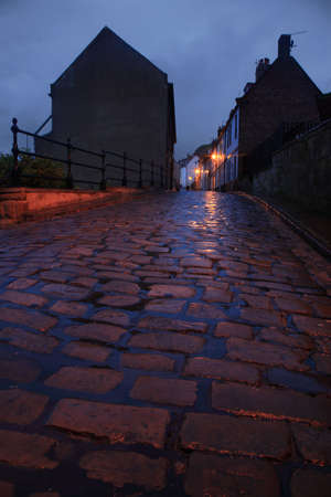 Cobbled street at dusk Whitby North Yorkshireの写真素材