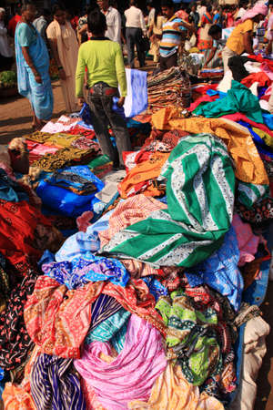 Fabric being sold in a busy street market, Goa, India 25 January 2008のeditorial素材