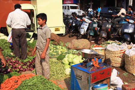 People at a food stall at Goan street market, India 25 January 2008のeditorial素材