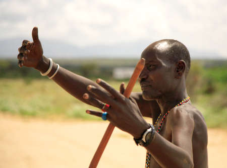 The chief of Samburu Village waving with a stick in his hand Kenya 20 January 2007のeditorial素材