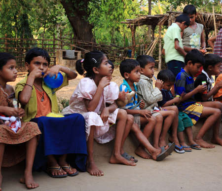 Young school children receiving gifts from tourists in Goa, India 26 June 2008のeditorial素材