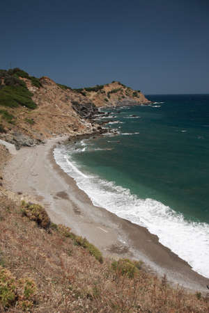Xanemos, the rocky beach at the end of the runway on the Greek island of Skiathiosの写真素材