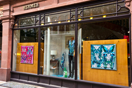 Window display of the Hermes French luxury goods boutique in the city centre.