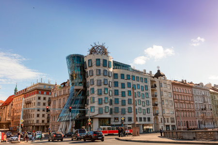 PRAGUE, CZECH REPUBLIC - NOVEMBER 14, 2015: Street view with very non traditional designed Dancing House on the Rasin Embankment nicknamed as Fred and Ginger House after the famous dancers.のeditorial素材