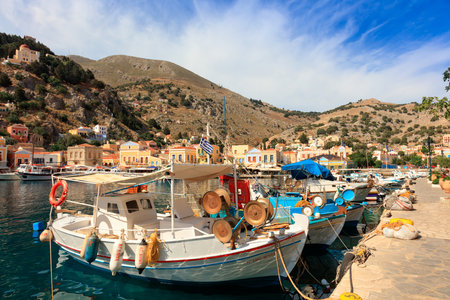 SYMI ISLAND, GREECE - JUNE 11, 2016: Fishing boats in picturesque harbor on the island of Symi in Agean Sea.のeditorial素材
