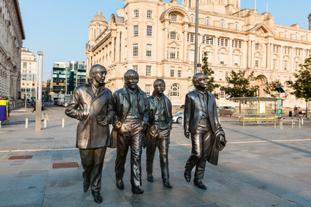 LIVERPOOL, UK - AUGUST 18, 2016:  Bronze statue of the four Liverpool Beatles stands on Liverpool Waterfront by sculptor Andrew Edwards.のeditorial素材