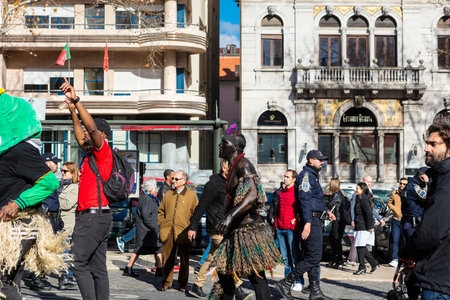LISBON , PORTUGAL - FEBRUARY 10, 2018: African dancer in costume at a procession on the Av. da Liberdade in Lisbon.のeditorial素材