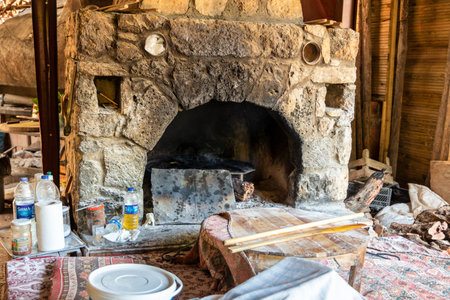 Rustic stone built wood burning oven in a small old restaurant in Turkey.のeditorial素材