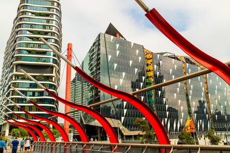 MELBOURNE, AUSTRALIA - March 21, 2019: Modern office buildings and pedestrian bridge near Southern Cross Station, formerly Spencer Station in Melbourne.のeditorial素材