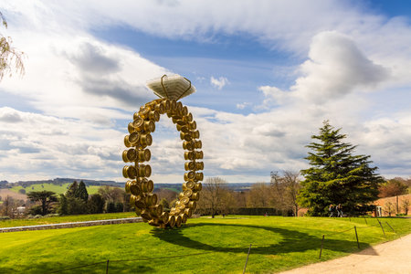 WAKEFIELD, YORKSHIRE, UK - April 13, 2021: Scenic view at the Yorkshire Sculpture Park with modern art sculpture Solitrio Solitaire (2018) by Joana Vasconcelos displayed in rural setting.のeditorial素材
