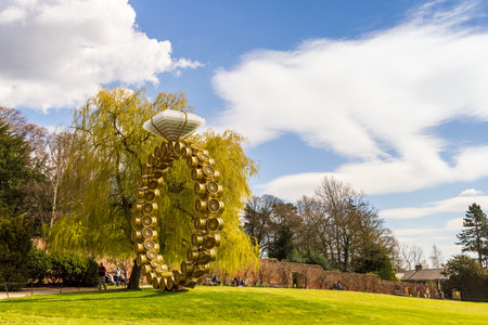 WAKEFIELD, YORKSHIRE, UK - April 13, 2021: Scenic view at the Yorkshire Sculpture Park with modern art sculpture Solitrio Solitaire (2018) by Joana Vasconcelos displayed in rural setting.のeditorial素材