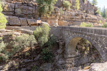 View of the Roman bridge over the River Eurymedon, Koprulu Canyon, Turkey.の写真素材