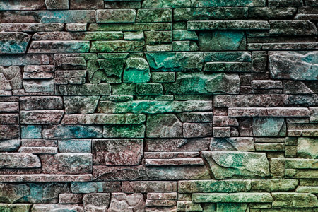 background texture of masonry decorative stones with shades of green, emeraldの写真素材