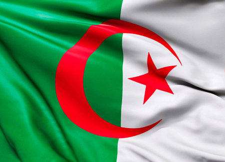 Algeria flag with big folds waving close up under the studio light indoors. The official symbols and colors in fabric bannerの写真素材