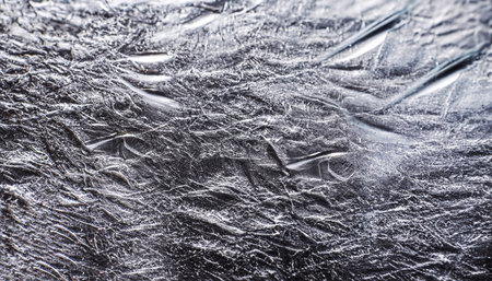 Silver texture of the material to be used as a background. High resolution photo.