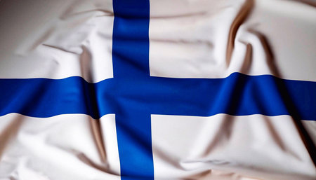 Fabric texture flag of Finland. Flag of Finland waving in the wind. Finland flag is depicted on a sports cloth fabric with many folds. sport team bannerの写真素材