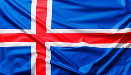 Iceland flag with big folds waving close up under the studio light indoors. The official symbols and colors in fabric bannerの写真素材