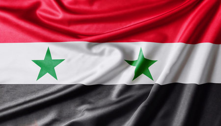 Fabric texture flag of Syria. Flag of Syria waving in the wind. Syria flag is depicted on a sports...