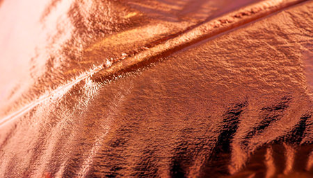 Gold foil leaf shiny metallic wrapping paper texture background for wall paper decoration elementの写真素材