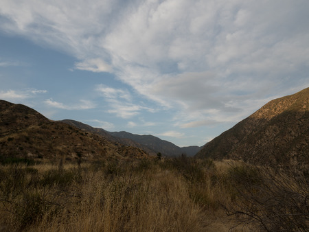 Blue cloudy sky above a valleyの写真素材