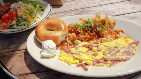 Scrambled Eggs with Ham, Serve with Cream Cheese and Bagel along with flying onion and green onion...
