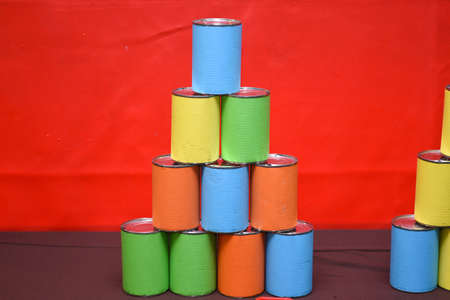 colorful can on red backgroundの写真素材