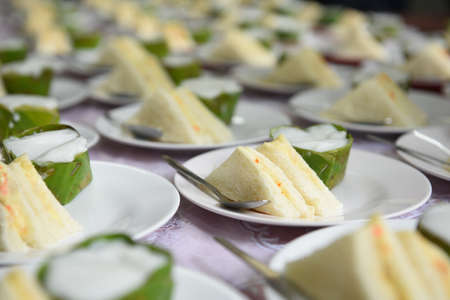 Sandwiches and thai desert in buffet line