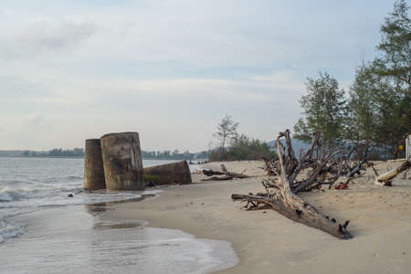 The ruins Cement pipe on the seaの写真素材