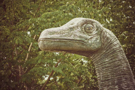 Vintage Dinosaur statue in the gardenの写真素材