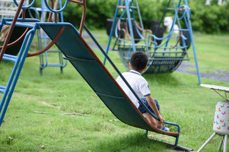 The boy playing at the playground.の写真素材