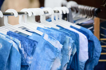 The indingo shirt hanging in the clothes line.の写真素材