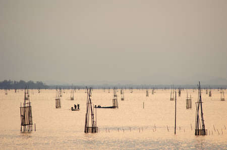 Fishermen are putting fish trap at Songkhla, Thailandの写真素材
