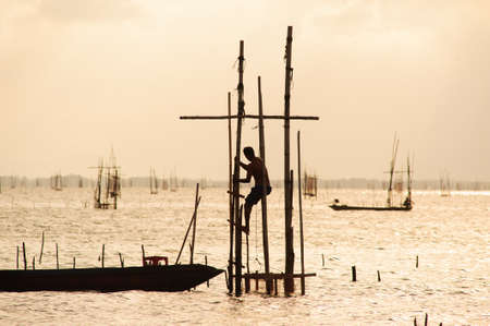 Fishermen are putting fish trap at Koh yo, Thailandの写真素材