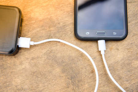 Never stop conecting, always conect theâ mobile withâ power bank charger.の写真素材