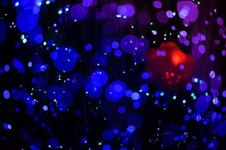 blur background, The blue bokeh of a lot. On a black backgroundの写真素材