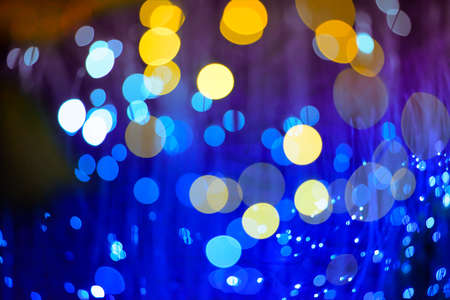 blur background, The yellow and blue bokeh of a lot. On a black backgroundの写真素材