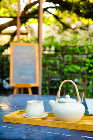 Hot tea is in the cup. Placed on a wooden tray. For a moment of rest of the day.の写真素材