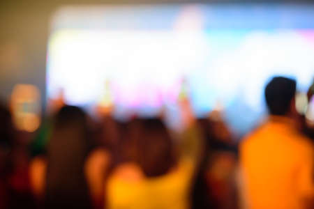 Blurred background , Bokeh lighting on stage in concert with audience, Celebration concept.の写真素材