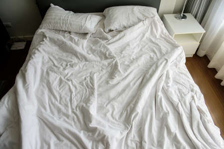 Blur ackground, White pillow crumpled after bed. relax time