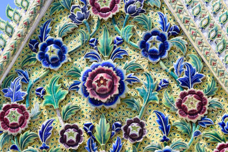 Stucco Pattern Porcelain Naga statue Beautifully installed on the gable of the Buddhist templeの写真素材