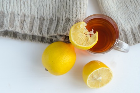 cup of tea with lemon , one and half lemon and woolen sweater.の写真素材
