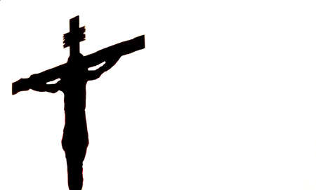Silhouette of the crucified Jesus on a white background, copyspace. Easter religous symbol.の写真素材