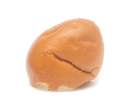 Ugly bitten-off inverted burger bun isolated on whiteの写真素材